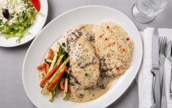 Tender charcoal broiled breast of chicken, prepared Greek style. Served with Caesar salad