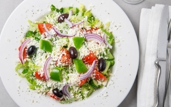 Romaine topped with Feta cheese, green pepper, red onion, cucumber, tomato, olive and dressing
